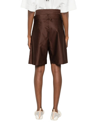 Brown shorts worn by a person by Dusan