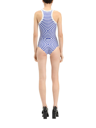 Person wearing a blue and white striped tank top with matching shorts