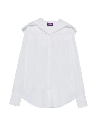 Crafted from pure cotton in crisp white, this Jean Paul Gaultier hooded shirt merges tailored polish with relaxed ease. A fixed hood, front button fastening, buttoned cuffs, and curved hem define the silhouette. Refined utility, distinctly Gaultier. Available at our Lisbon store.