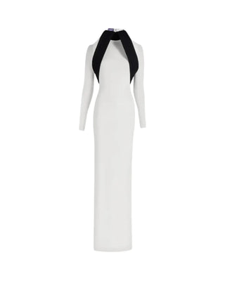 Crafted from a mixed wool and crepe jersey, this Jean Paul Gaultier dress sculpts the figure with a high neck, long sleeves, and a precisely tailored silhouette. In crisp white, it balances structure and fluidity for an elevated, modern look. Available at our Lisbon store.