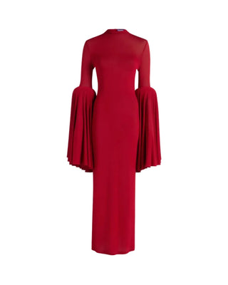 Crafted in striking red, this Jean Paul Gaultier long dress features a round neck and long sleeves finished with elegant pleated cuffs. A zip rear fastening and straight hem complete the clean, elongated silhouette. Refined drama with effortless ease. Available at our Lisbon store.