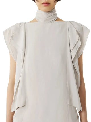 Off white sleeveless top with ruffled shoulders and high neck