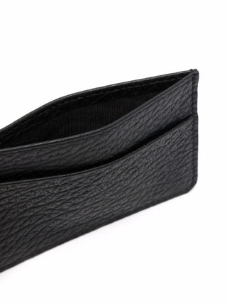 Close-up of a black leather card holder by Maison Margiela