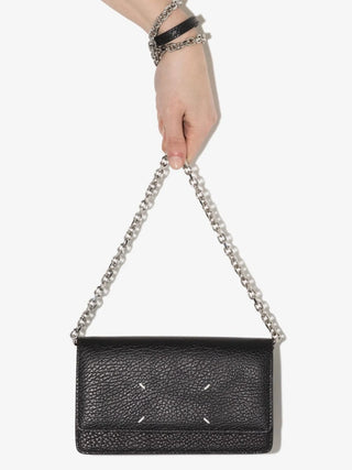 Black four stitches pebbled leather wallet with chain strap by Maison Margiela