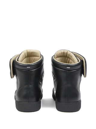 Black high-top sneakers with beige interior by Maison Margiela