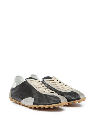 Pair of black and white leather sneakers  by Maison Margiela