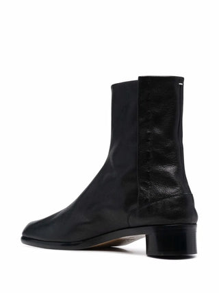 Black leather ankle boots by Maison Margiela