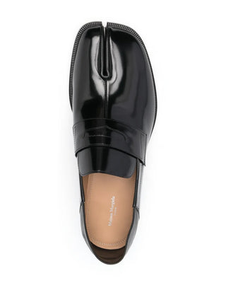 Black leather slip-on loafer by Maison Margiela