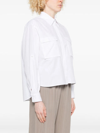 Person wearing Max Mara pocket Layered shirt with Brown pants. 