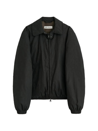 Crafted from premium Japanese cotton-nylon this collared puffa jacket from Our Legacy features a snap-tab collar, two-way zip closure, and duck down padding.