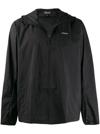 Black rain jacket with a brand logo by Patagonia