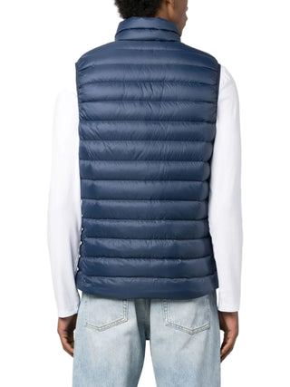 Person wearing a blue puffer gilet by Patagonia