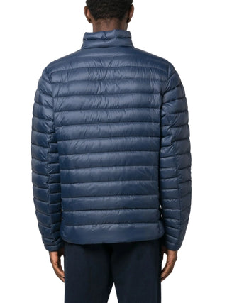 Blue puffer jacket by Patagonia worn by a person 