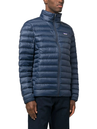 Man wearing a blue Patagonia puffer jacket 