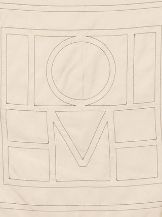 Beige scarf with 'TOTEME' embroidered in a geometric pattern