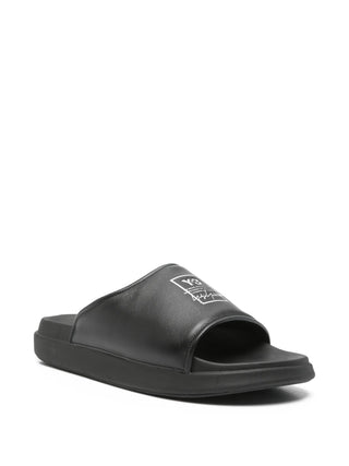 Black leather slides with rubber soles by Y-3