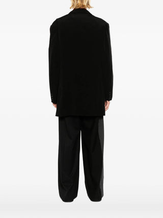 Person wearing a black outfit 